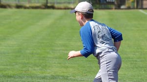 Baseball player running onto the field